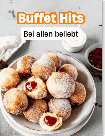 Ein Teller voller Mini-Berliner gefüllt mit Marmelade